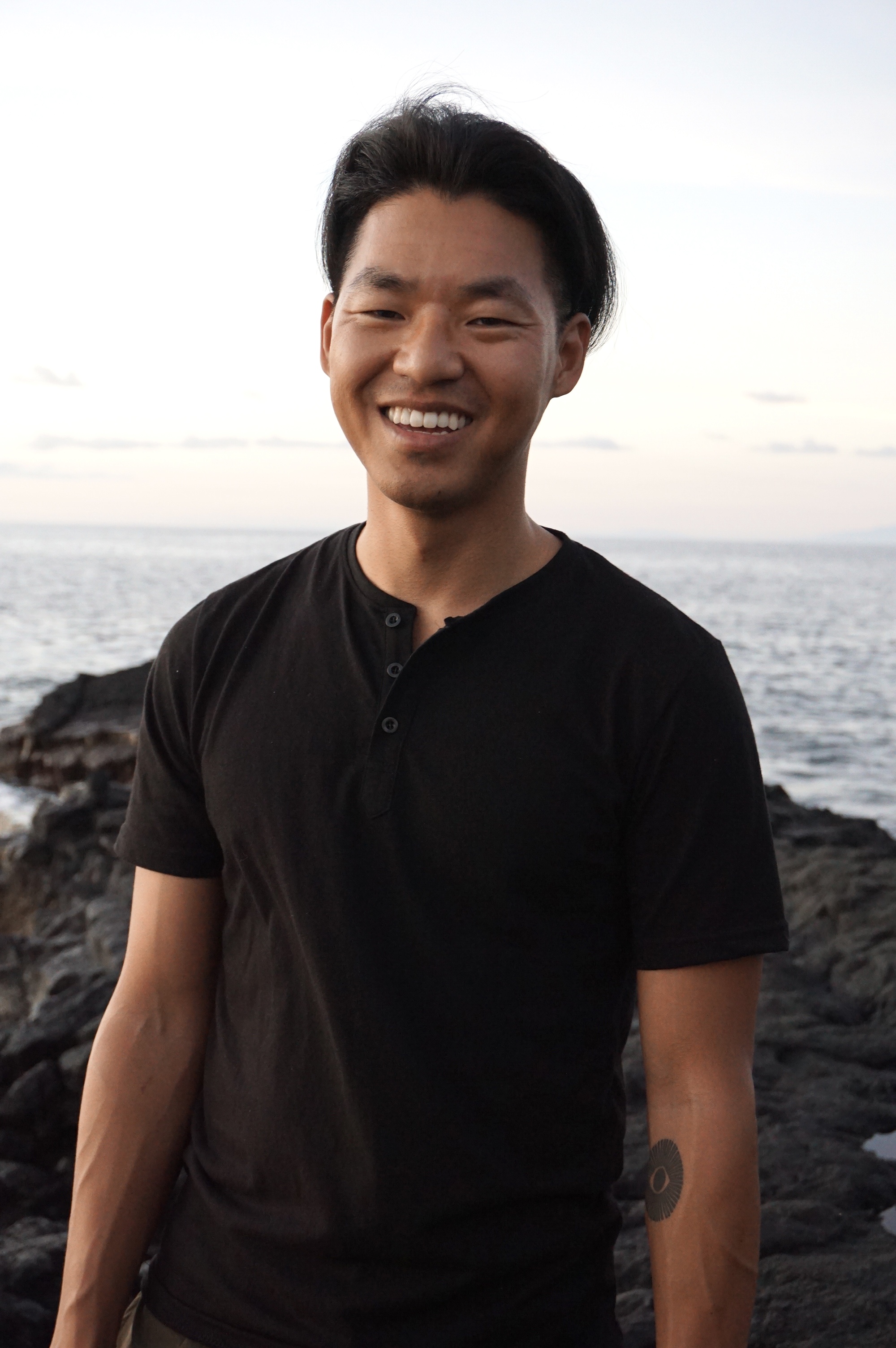 Zack Dinh standing by the ocean