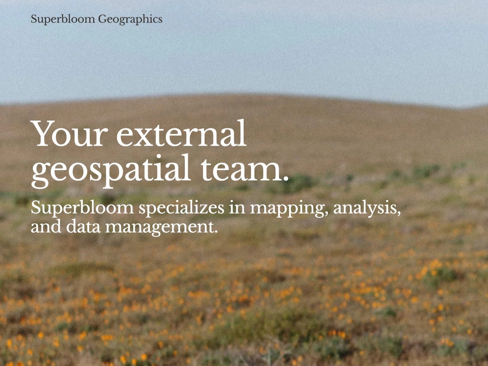 Superbloom Geographics hero image with poppy field and tagline