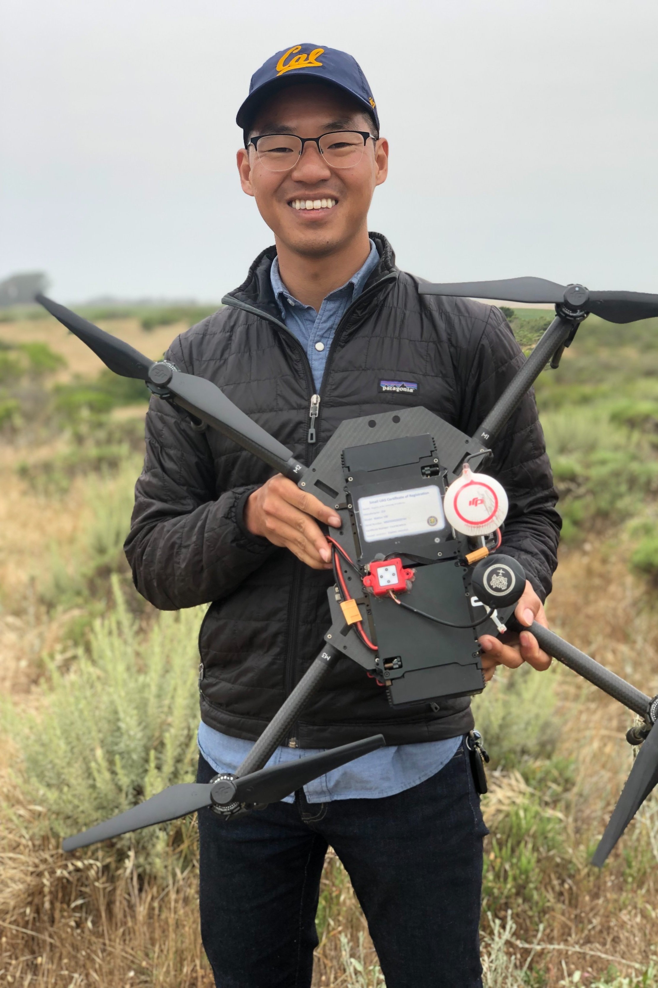 Zack Dinh outdoors with a drone controller